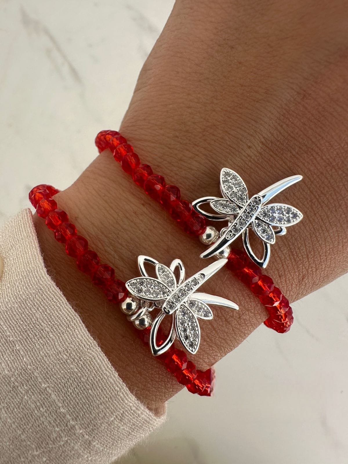 Pulsera elastica Puedritas cristal de roca con dije giratorio